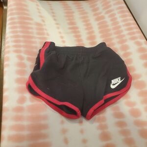 Nike 2t Girls Black Shorts with Red Trim and White Logo